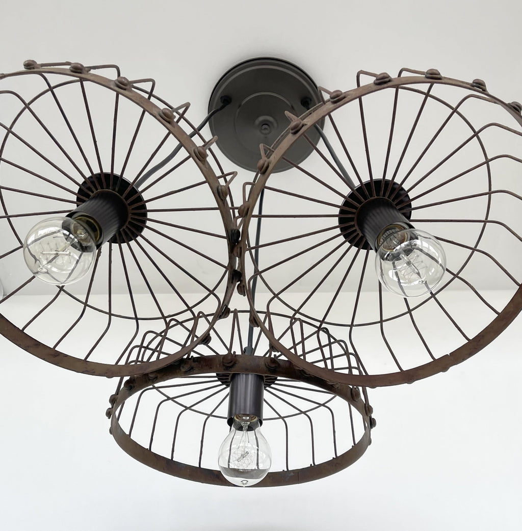 Rustic Wagon Wheel Industrial Three‑Light Chandelier