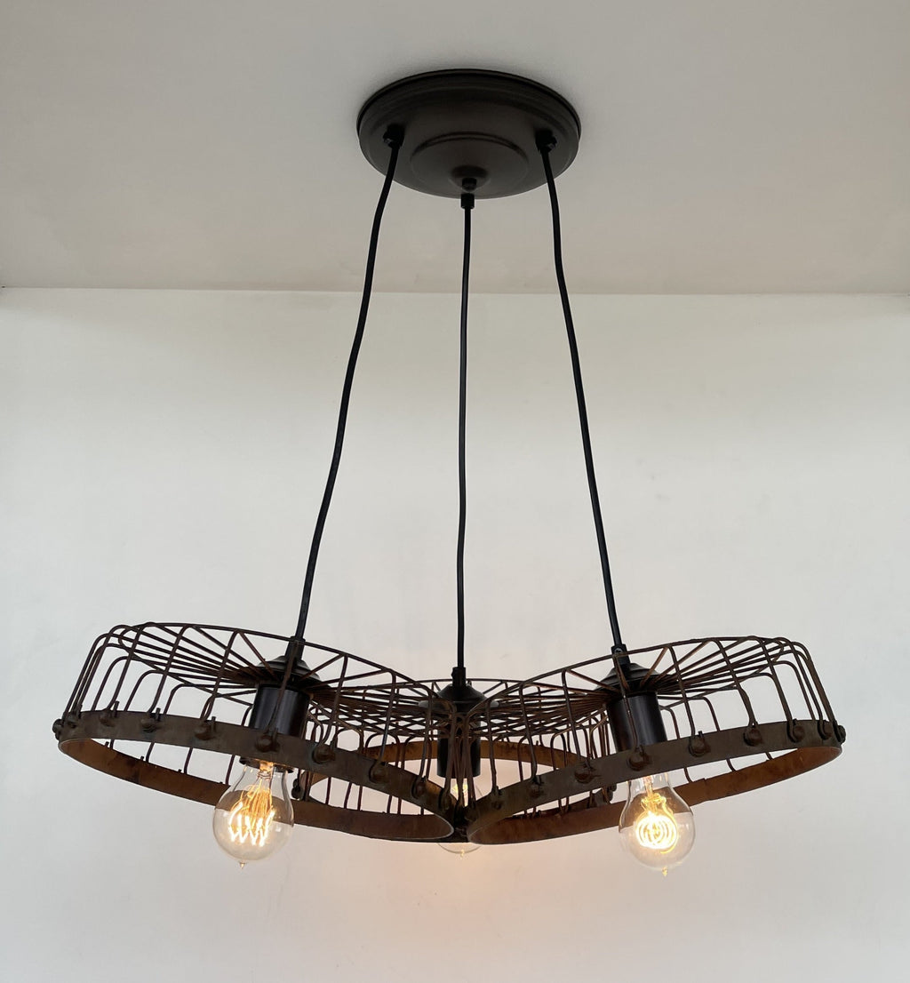 Rustic Wagon Wheel Industrial Three‑Light Chandelier