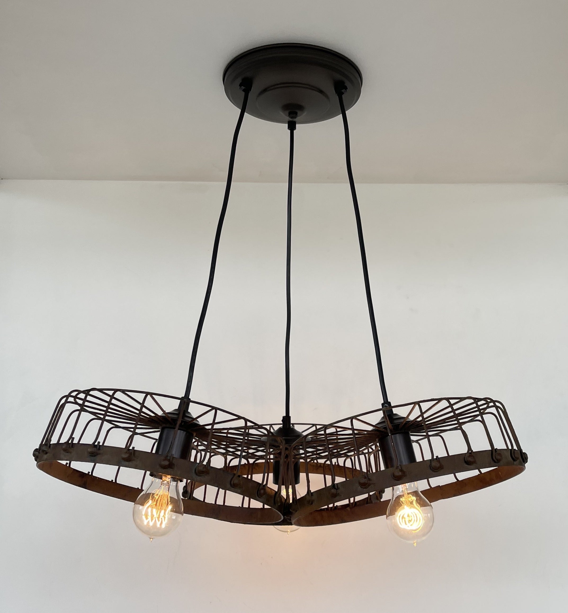 Rustic Wagon Wheel Industrial Three‑Light Chandelier