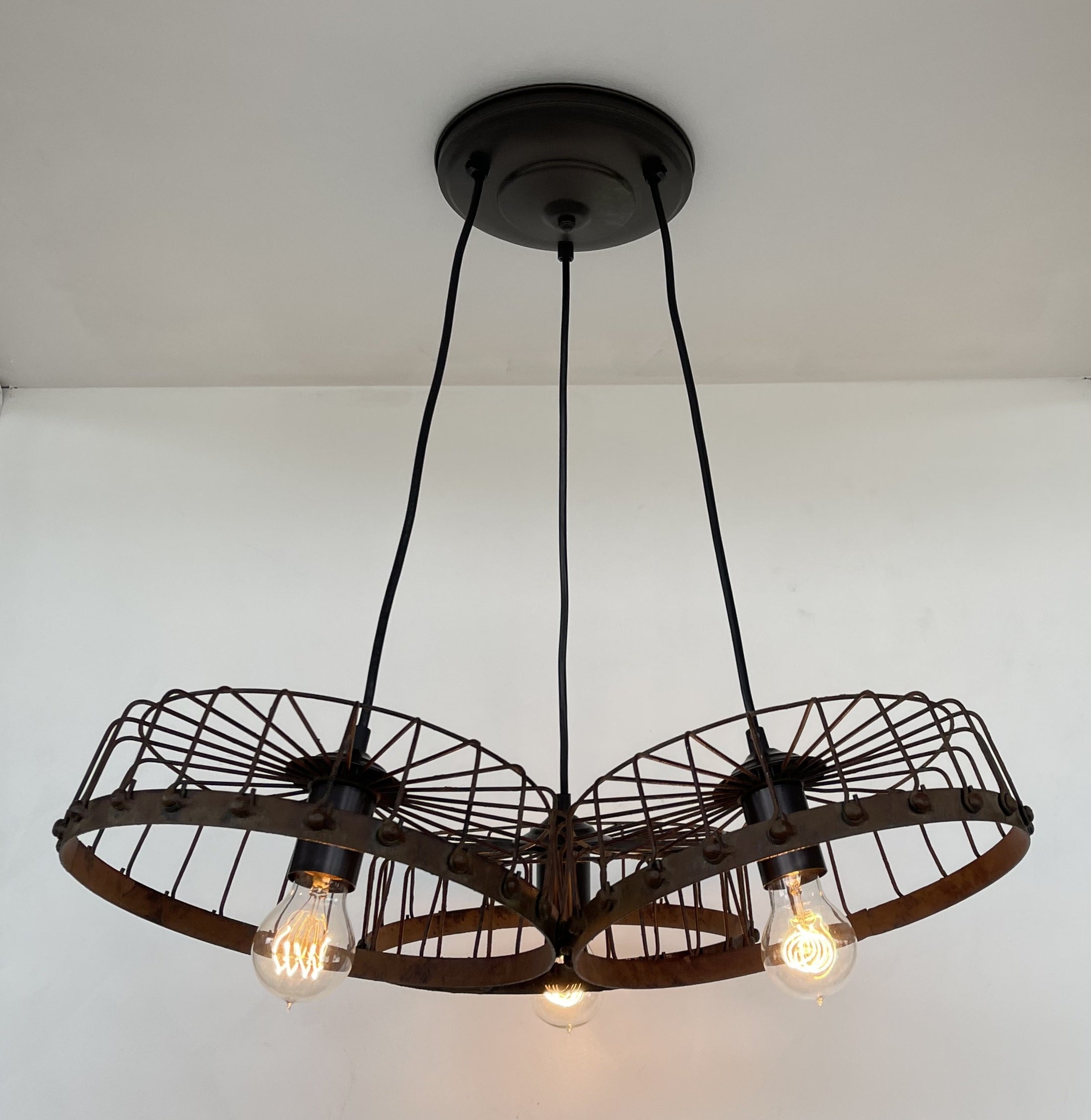 Rustic Wagon Wheel Industrial Three‑Light Chandelier